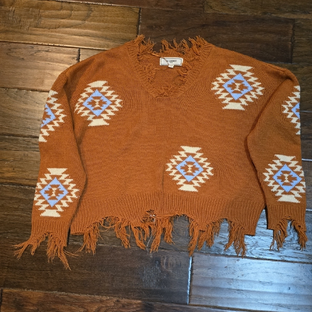 Fringed Orange Sweater with Geometric Patterns